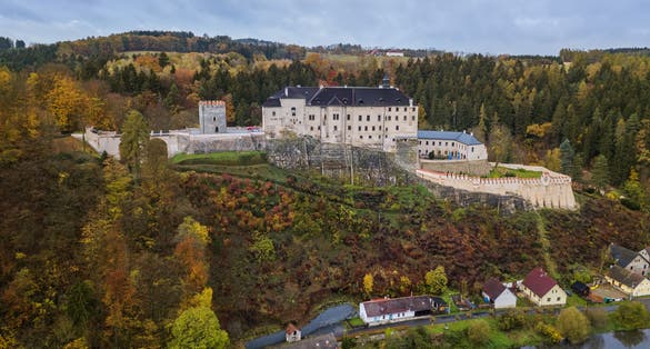 Photo of aerial view of Český Šternberk Castle on top of hill overlooking Czech countryside in Bohemian region, Czech Republic.