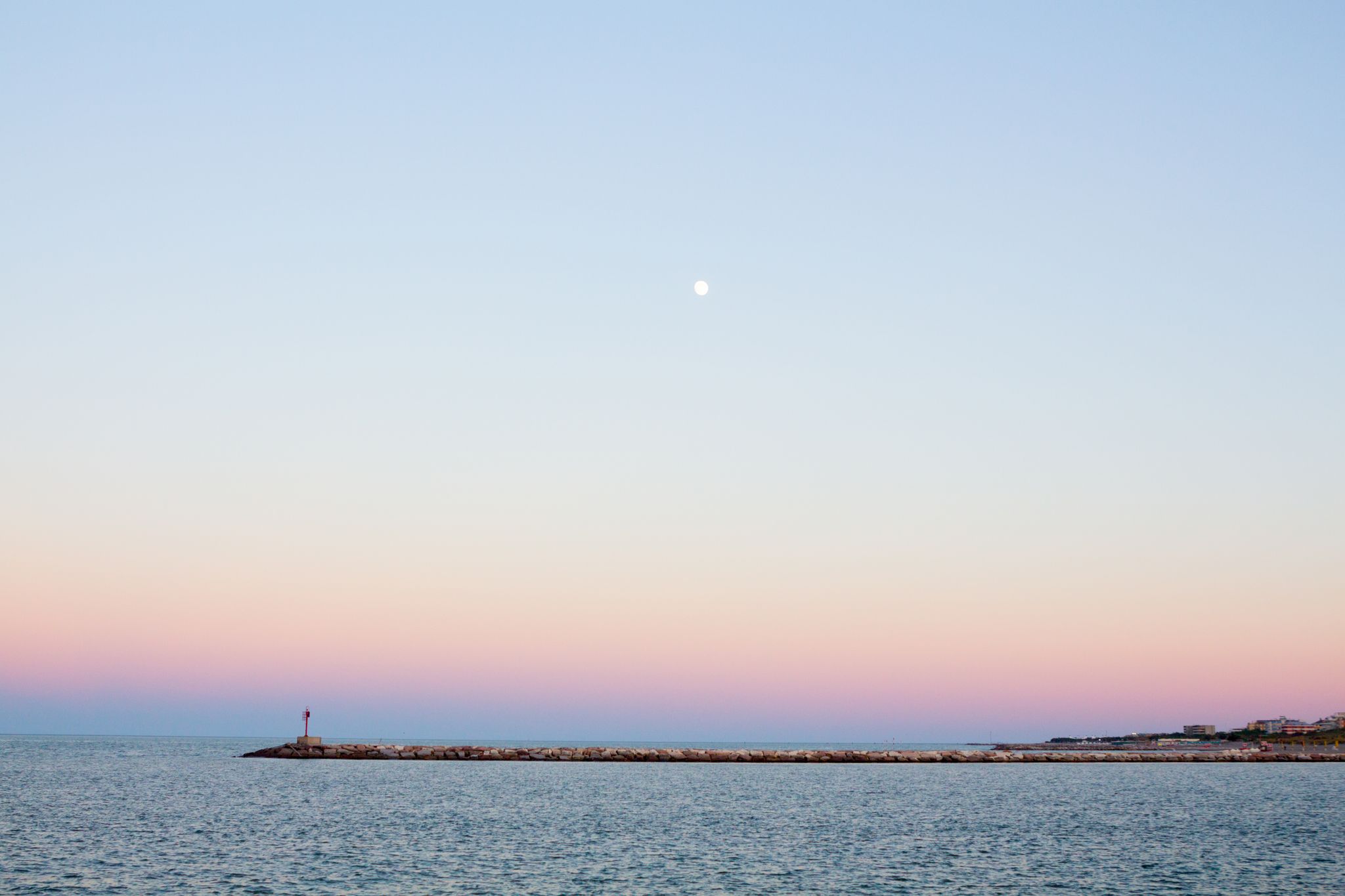 Photo of Aerial view of the white tall apartment buildings of the coast of Chioggia in Italy.