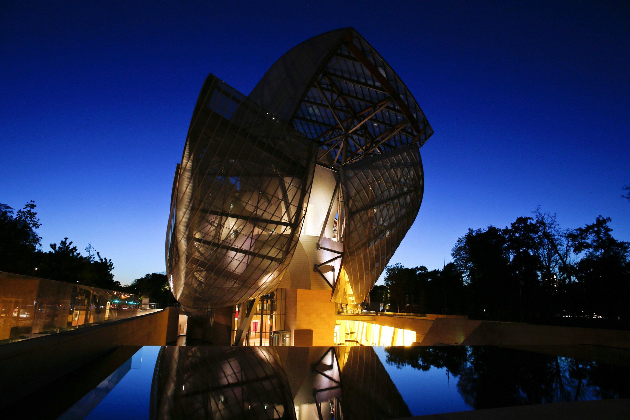 photo of Louis Vuitton Foundation at night in Paris, France.
