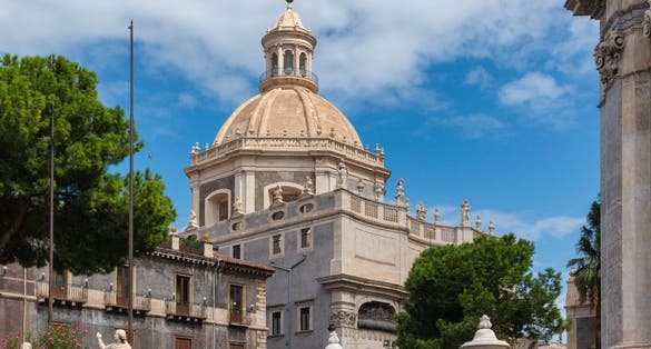 photo of view of Sculpture of St Agata and view of Church of the Abbey of Santa Agata in Catania, Italy.