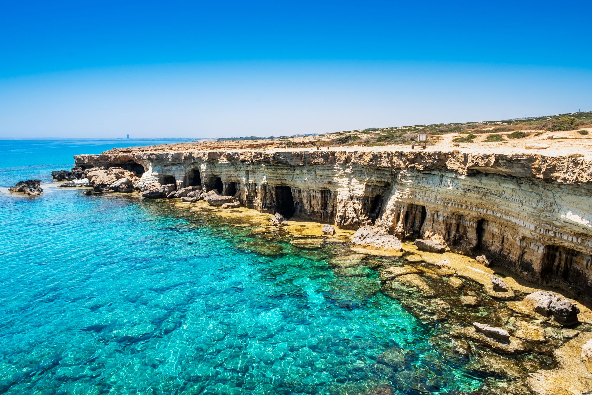 Photo of Sea caves near Ayia Napa in Cyprus. Natural rock formation famouse for cliff jumping into clear water.