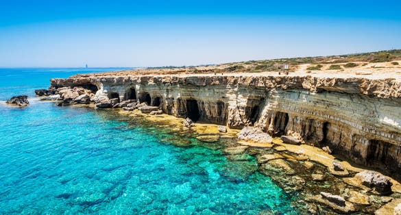 Photo of Sea caves near Ayia Napa in Cyprus. Natural rock formation famouse for cliff jumping into clear water.
