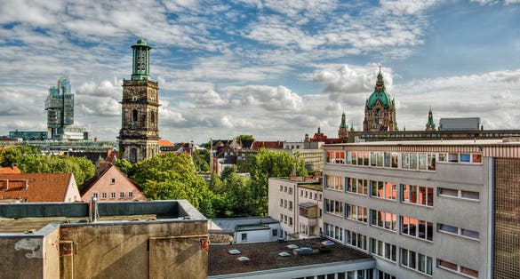 Cityscape of Hanover (Germany), including the modern building of a bank, the church Aegidienkirche and the town hall, HDR-technique