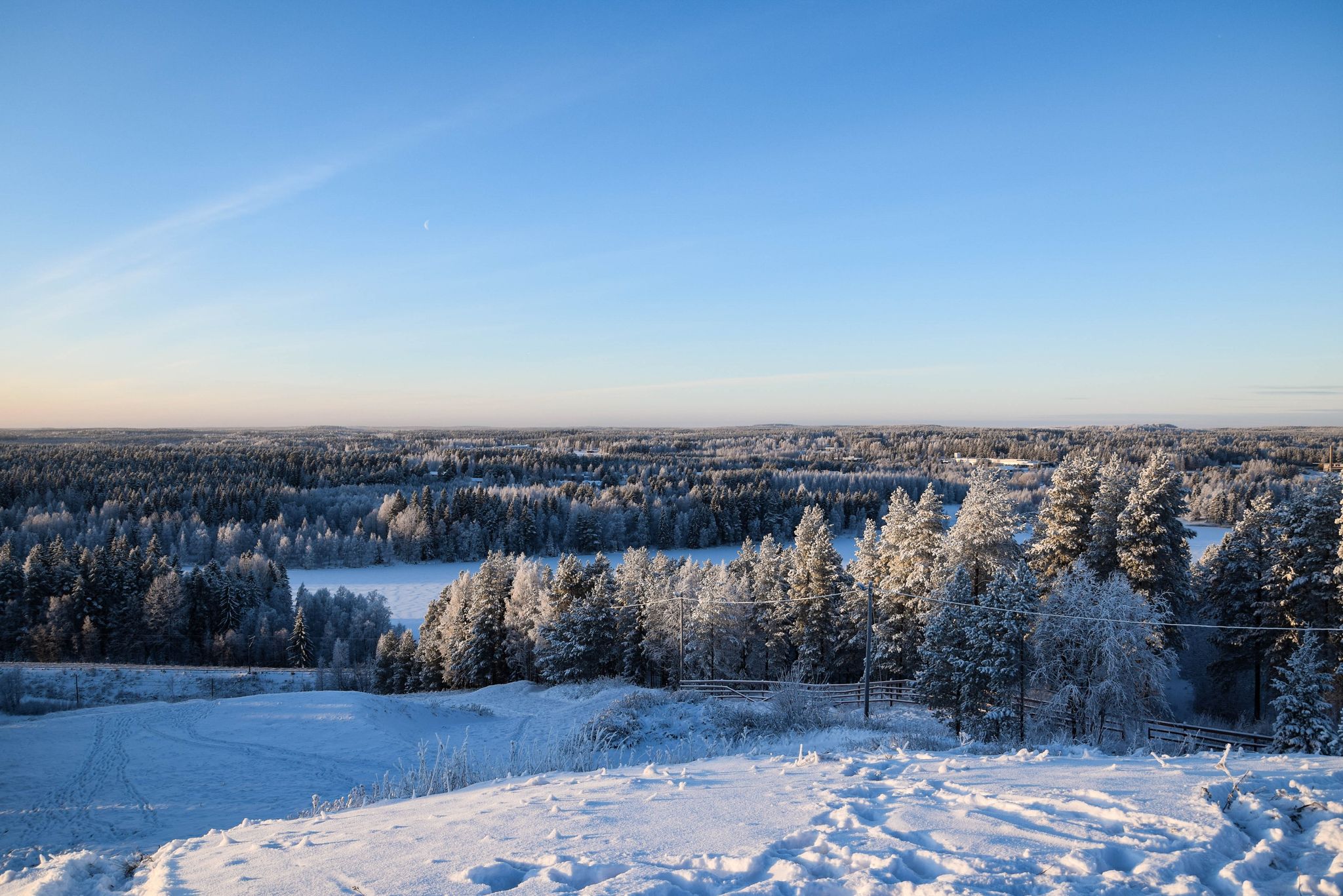 Cold winter day in Kajaani, Finland. This magical photo was shot during sunset on top of a hill.