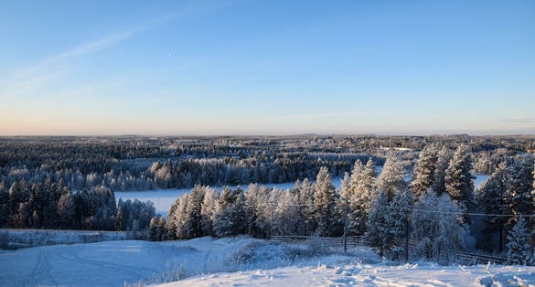 Cold winter day in Kajaani, Finland. This magical photo was shot during sunset on top of a hill.