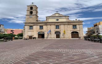 Photo of aerial view of Chania with the amazing lighthouse, mosque, venetian shipyards, Crete, Greece.