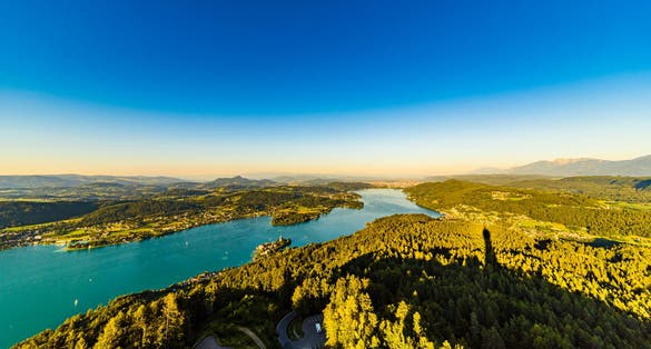 Photo of view from Pyramidenkogel tower on lake and Klagenfurt the area, Austria.