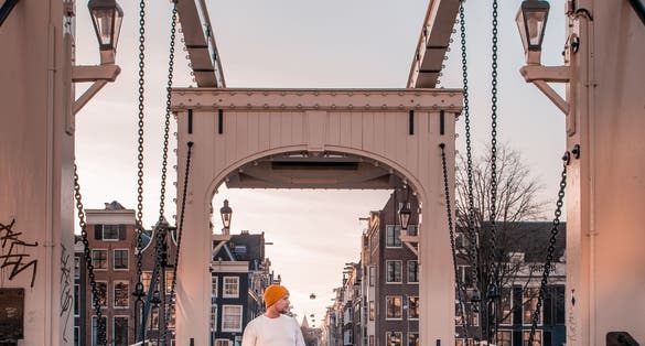 photo of young men at the Magere Brug in Amsterdam, the Netherlands.