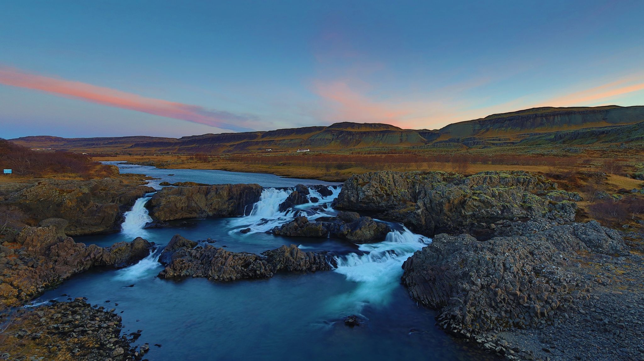 photo of Glanni Waterfall Iceland at sunset .