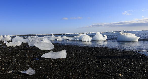 photo of view of View of a glacier on the diamond beach in the south of the Vatnajökull glacier between Vatnajökull National Park and the town of Höfn, Iceland.