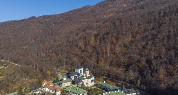Photo of Aerial image of the Lainici monastery in the gorges of the Jiu river, Romania .