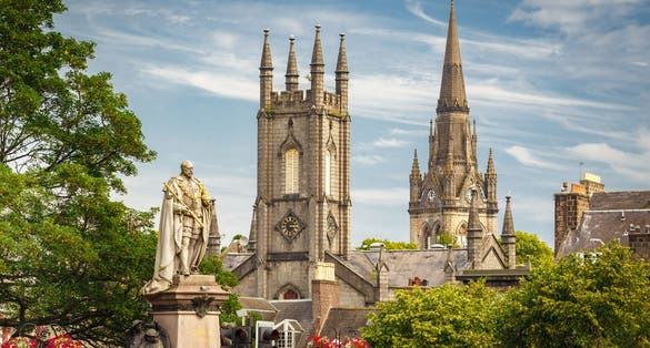Photo of Statue of Edward VII with Former South Church with Kirk of St Nicholas (Triple Kirk) in the background, in Aberdeen, Scotland, UK.
