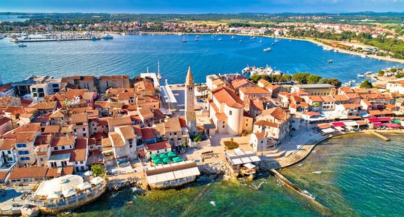 Photo of aerial view of town of Umag historic coastline architecture , archipelago of Istria region, Croatia.