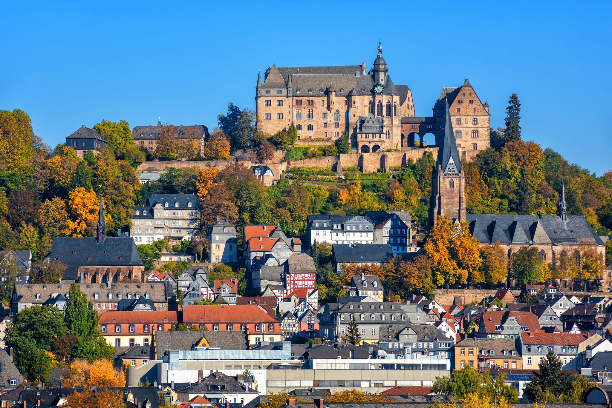 Photo of Marburg an der Lahn historical Old Town with castle Landgrafenschloss, St. Elizabeth church and medieval colorful half-timbered houses, Germany.