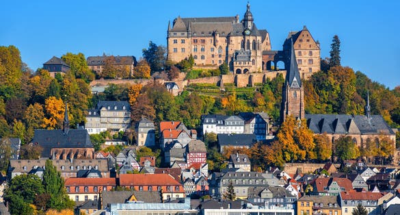 Photo of Marburg an der Lahn historical Old Town with castle Landgrafenschloss, St. Elizabeth church and medieval colorful half-timbered houses, Germany.