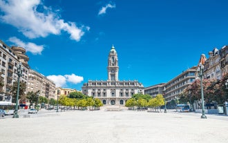 Porto, Portugal old town ribeira aerial promenade view with colorful houses, Douro river and boats.
