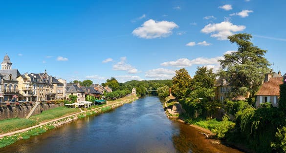 photo of the town of Montignac at the shore of Vezere River, in Dordogne-Perigord, France.