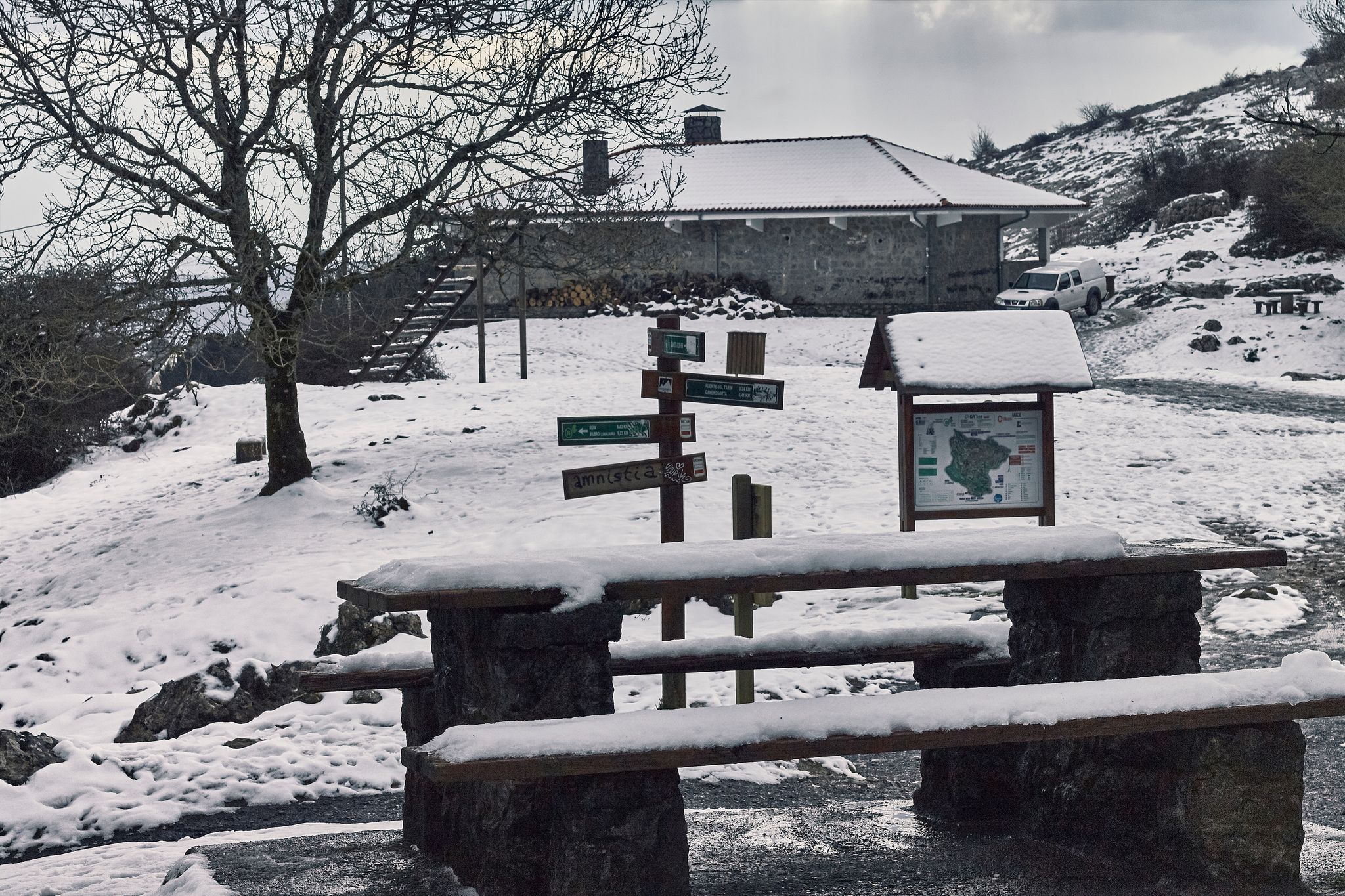 Photo of Tables covered with snow in the Pagasarri, in Bilbao ,Spain .