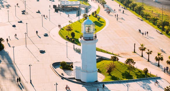 Photo of Batumi lighthouse on the Batumi Seafront Promenade on a sunny day, Georgia.