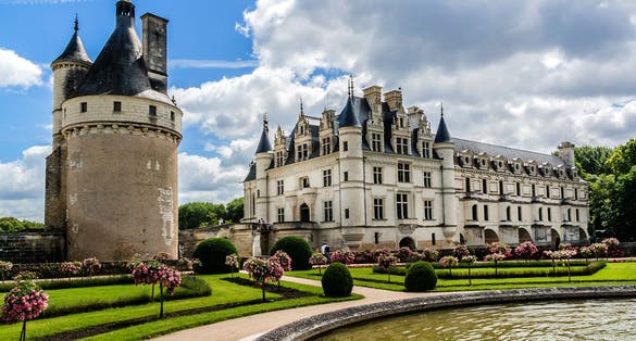 Photo of Medieval Chateau de Chenonceau (1514 - 1522) spanning River Cher in Loire Valley in France.