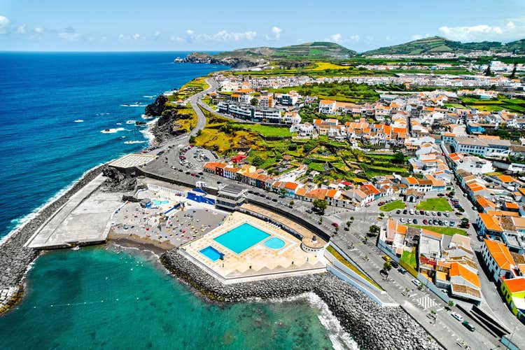 Aerial shot, drone point of view of Ribeira Grande town in the Ponta Delgada island. Sao Miguel, Azores, Portugal. Travel destinations and tourism concept