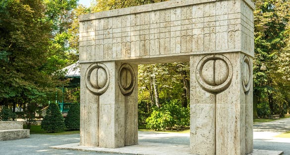 Photo of The Gate of the Kiss Stone Sculpture Made By Constantin Brancusi in 1938 In Targu Jiu, Romania.