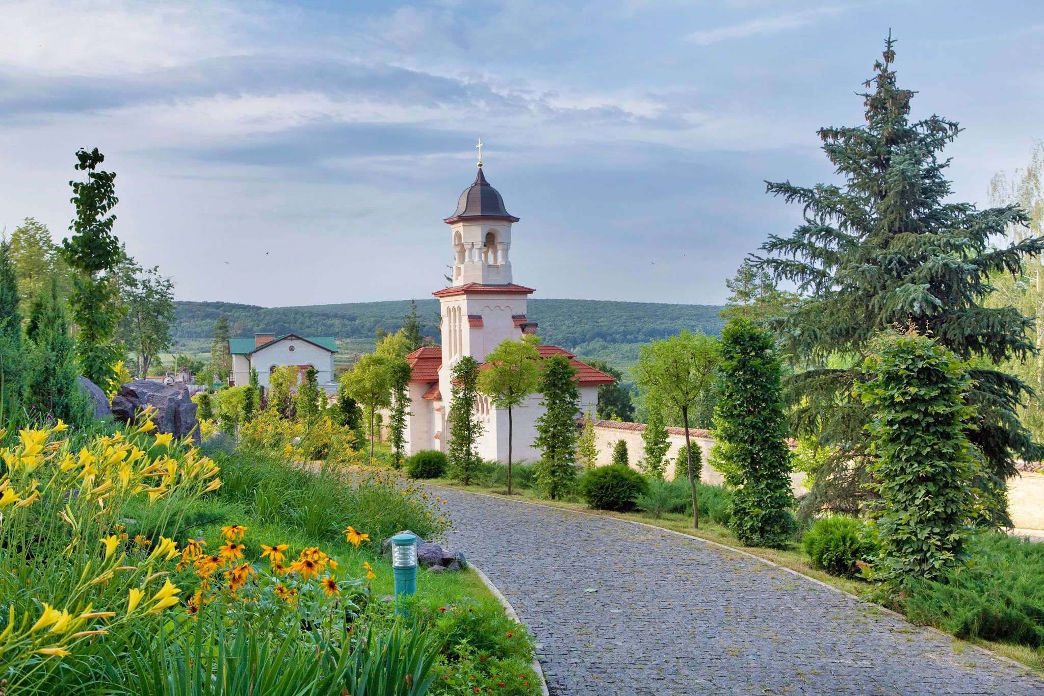 Photo of famous Curchi Monastery with green trees in Curchi,  Raionul Orhei, Moldova.