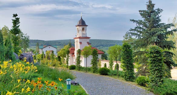 Photo of famous Curchi Monastery with green trees in Curchi,  Raionul Orhei, Moldova.