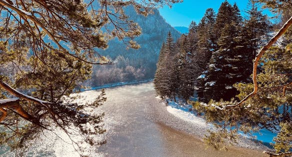 photo of view of View of famous and amazing Neuschwanstein Castle, Füssen, Bavaria, Germany, seen from the Marienbrücke (Mary's Bridge), a pedestrian bridge built over a cliff