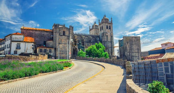 Photo of Porto Cathedral Roman Catholic church or Se do Porto and cobblestone road in Porto Oporto city historical centre, Norte or Northern Portugal.
