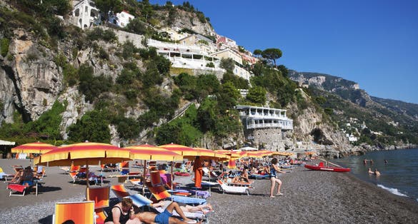 Tourists on the beach, Amalfi, Province Of Salerno, Gulf Of Salerno, Tyrrhenian Sea, Campania, Italy.