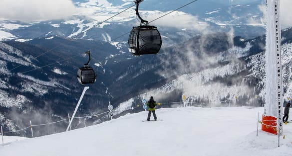 Photo of snowboarder at the slope of chopok mountain in slovakia copy space.