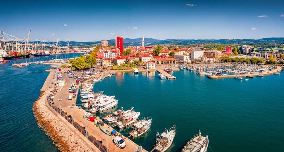 Adorable view from flying drone of Koper port. Colorful summer scene of Adriatic coastline, Slovenia, Europe. Picturesque Mediterranean seascape. Traveling concept background.