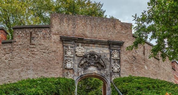 photo of The Burcht van Leiden (Fort of Leiden) is an old shell keep in Leiden constructed in the 11th century. Netherlands. Portal in the keep wall at the top of the steps, by Verhulst, 1658.
