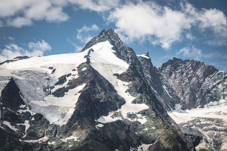 photo of view of View of Grossglockner, Austria's highest mountain peak. Below is the Pasterze Glacier. Photo taken from Kaiser-Franz-Josefs-Höhe, which is accesible via Großglockner Hochalpenstraße. Gemeinde Kals am Großglockner, Austria.