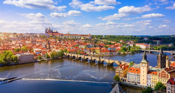 Photo of scenic view of the old town pier architecture and Charles Bridge over Vltava river in Prague, Czech Republic.