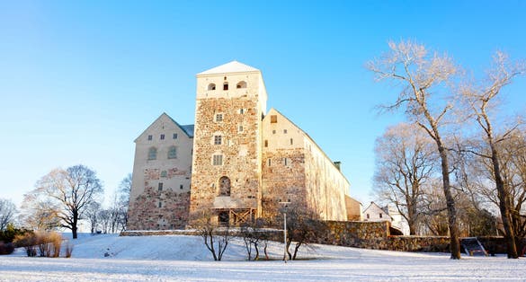 Photo of winter landscape of Turku castle medieval building in the city of Turku in Finland.