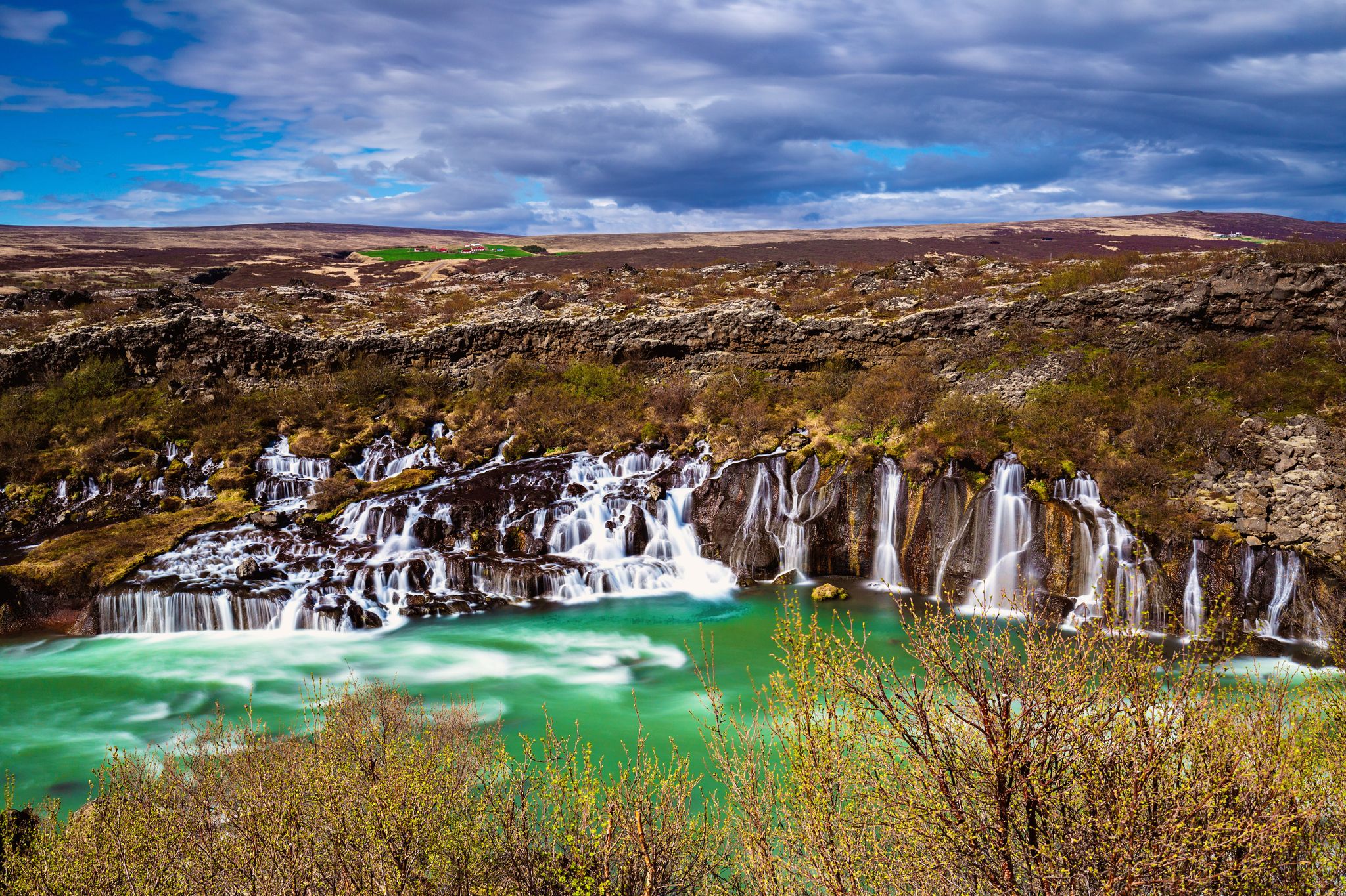 photo of Hraunfossar, a series of waterfalls pouring into Hvita River, Borgarfjordur, Western Iceland,