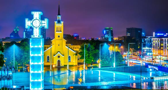 Photo of night view of the Cross of liberty on the freedom square in Tallin, Estonia.