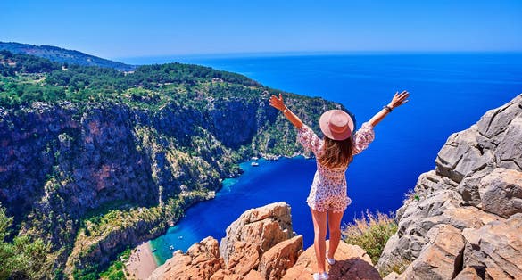 Photo of aerial view of amazing beach Butterfly Valley in Oludeniz Fethiye Turkey.