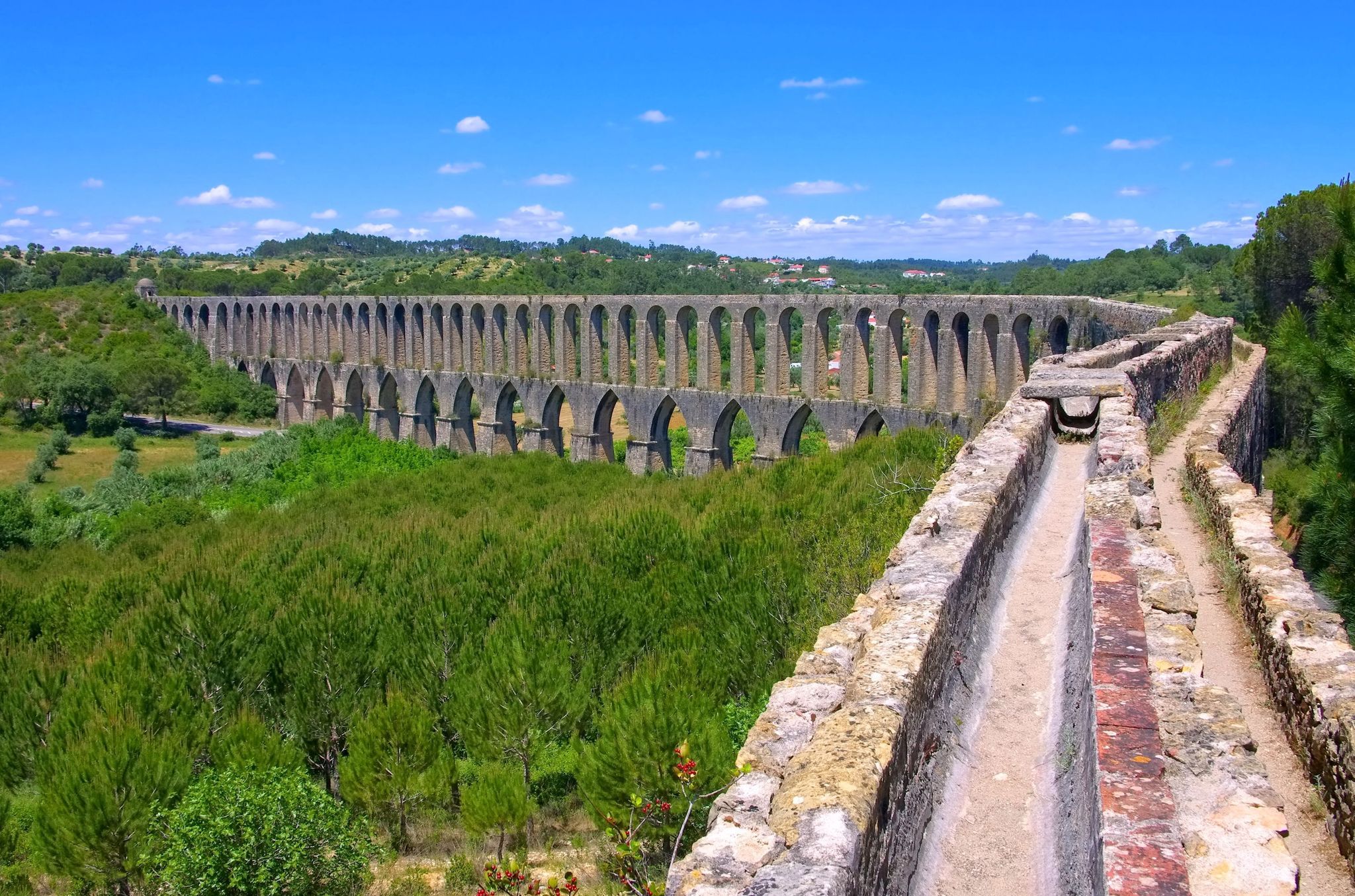 Tomar Aqueduct or Aqueduto de Pegoes, ancient stone masonry building, amazing monument. It was built in the 17th century to bring water to the convent of Christ in Tomar under command of king Philip I