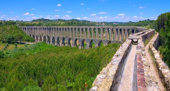 Tomar Aqueduct or Aqueduto de Pegoes, ancient stone masonry building, amazing monument. It was built in the 17th century to bring water to the convent of Christ in Tomar under command of king Philip I