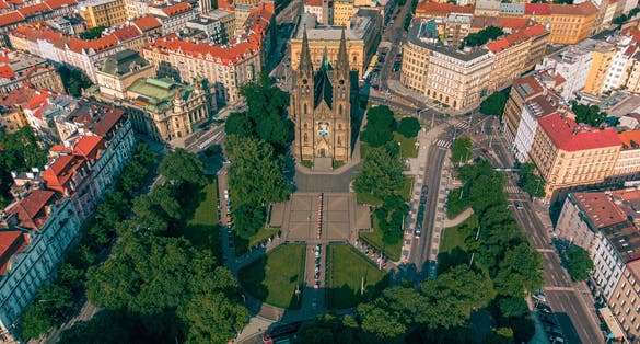 Photo of aerial view of Peace Square (Namesti Miru) Vinohrady Quarter, Vinohrady Theatre and the Cathedral of St. Ludmila at the district of Vinohrady, Prague, Czech Republic.