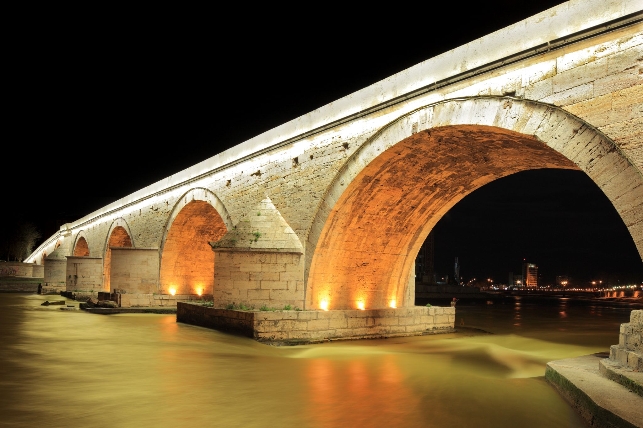 Photo of famous Stone bridge at night in Skopje, Macedonia.