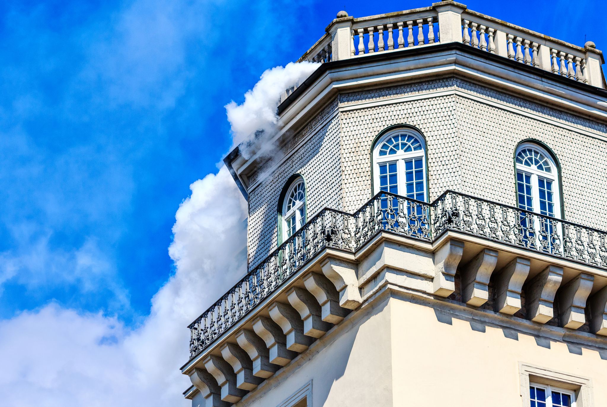 photo of Fridericianum (built in 1769-1779) in Kassel - White smoke from the tower at the museum - documenta opened-Hesse, Germany.