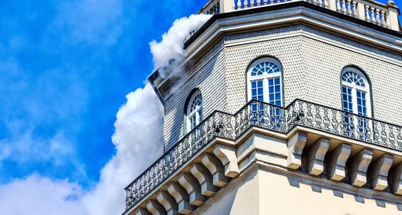 photo of Fridericianum (built in 1769-1779) in Kassel - White smoke from the tower at the museum - documenta opened-Hesse, Germany.