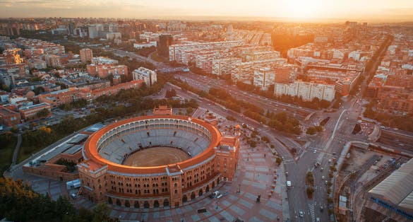 Photo of Madrid Plaza de Toros de Las Ventas (Las Ventas Bullring) aerial view with historical buildings in Spain.