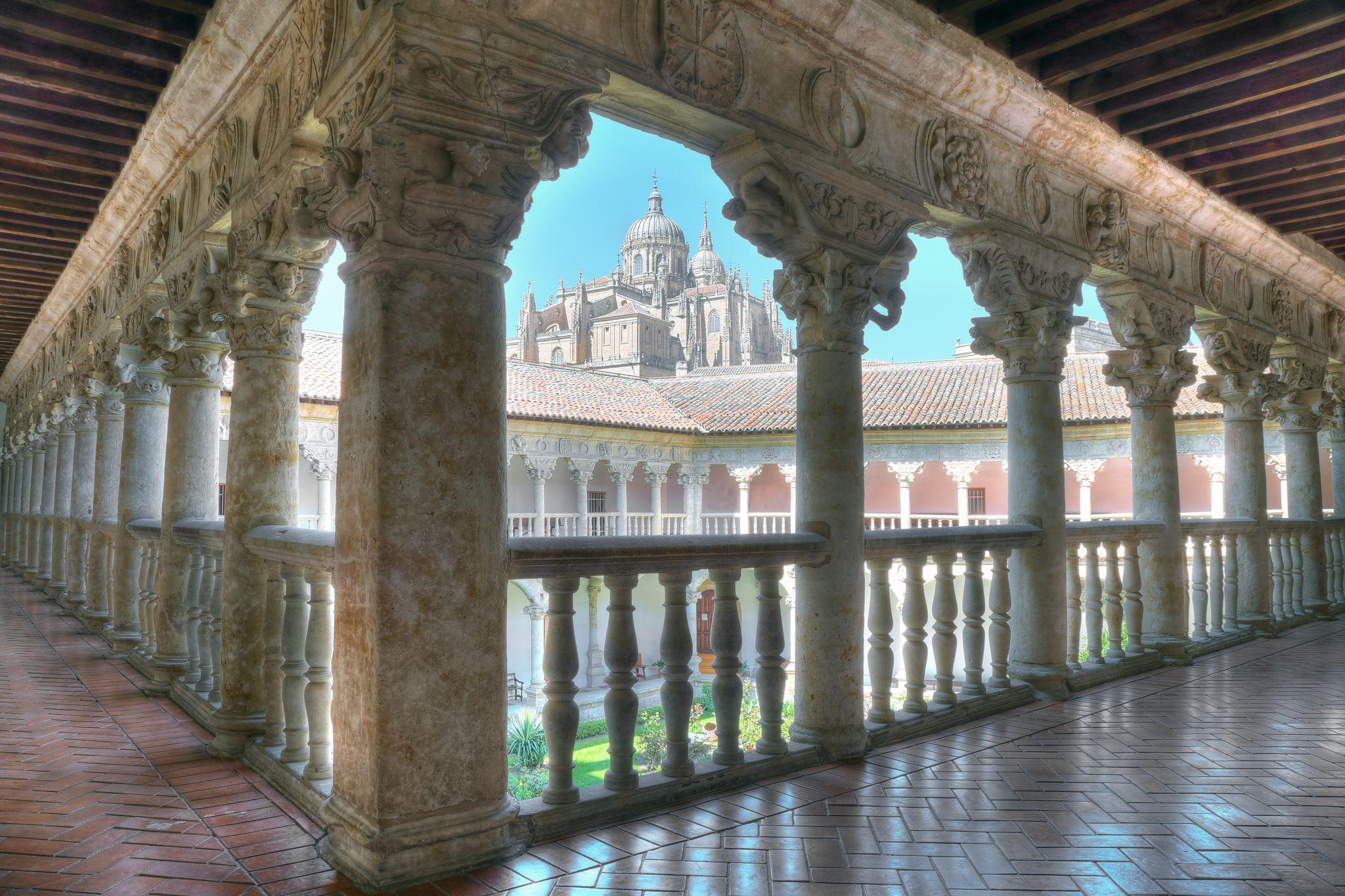 Photo of cloister of the convent of the owners with the cathedral in the background in Salamanca, Spain.