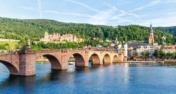 photo of view of Heidelberg with castle, Neckar river and old town bridge in Heidelberg, Germany.