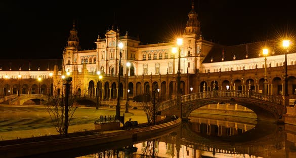 Photo of Plaza de EspaÃ±a (Spain square) at night in Seville, Andalusia .